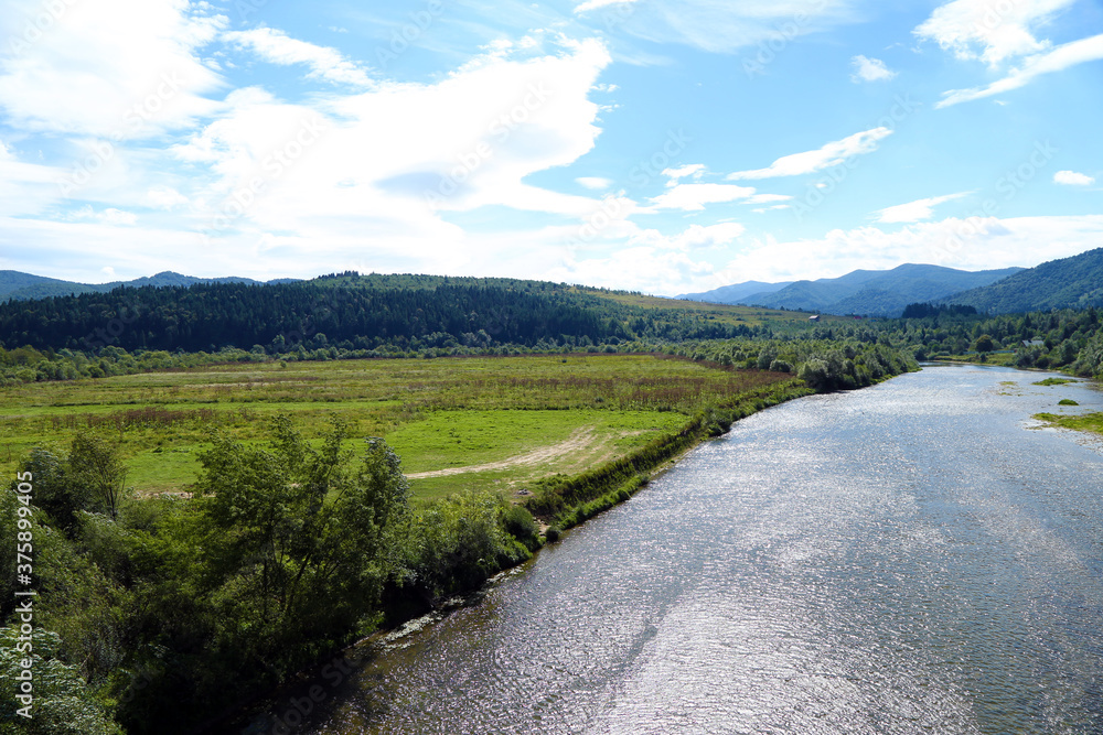 Obraz premium summer landscape with mountains and river
