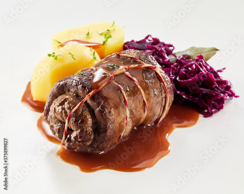 Single beef roulade with red cabbage and potato photo