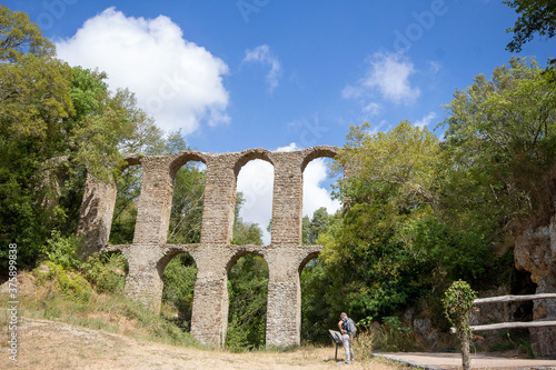 The 17th century aqueduct of Monterano Natural Reserve.A ghost medieval city in the country of Lazio region province of Rome,Monterano, born in Etruscan times on top of a small tuff hill,Italy