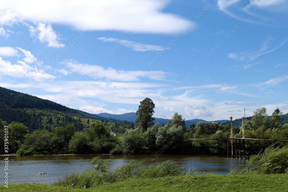 summer landscape with mountains and river
