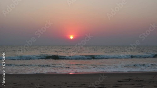 Ocean and beach at sunset.