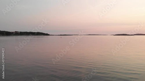 Wallpaper Mural Flying over the sea at sunset entering a stone bridge Torontodigital.ca