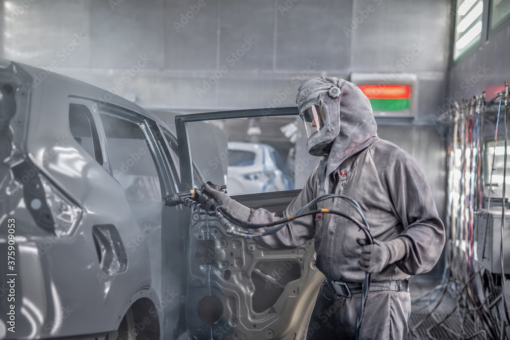 employee body painting workshop carries out painting of the internal elements of the car. employee body painting workshop carries out painting of the internal elements of the car.