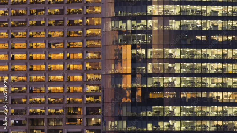Office buildings. Day to night timelapse. Overworking, finance, business district and office concepts. Office buildings. Day to night timelapse. Overworking, finance, business district and office concepts.