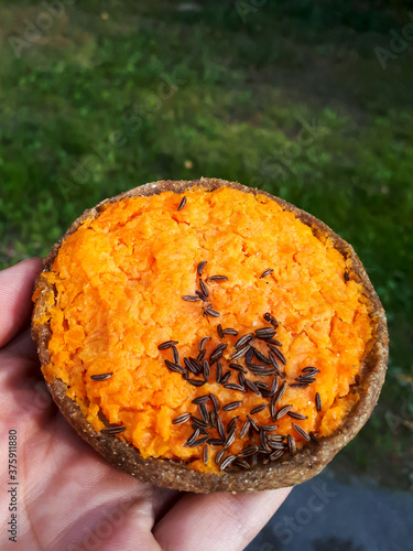 The traditional Latvian carrot pie sklandrausis with cumin seeds photo