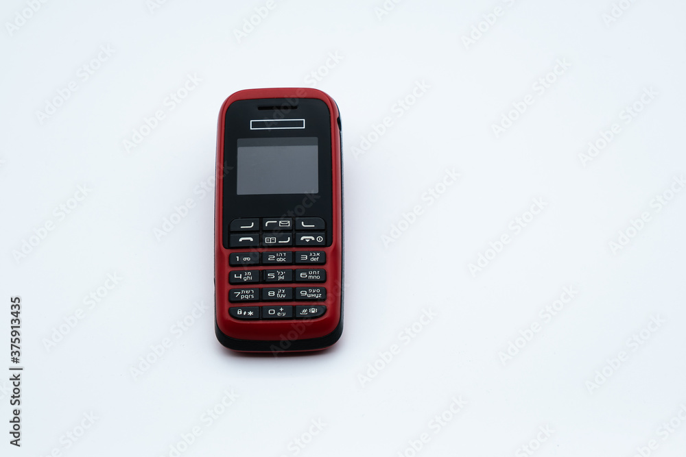 Old cell phone isolated on white background Old cell phone isolated on white background