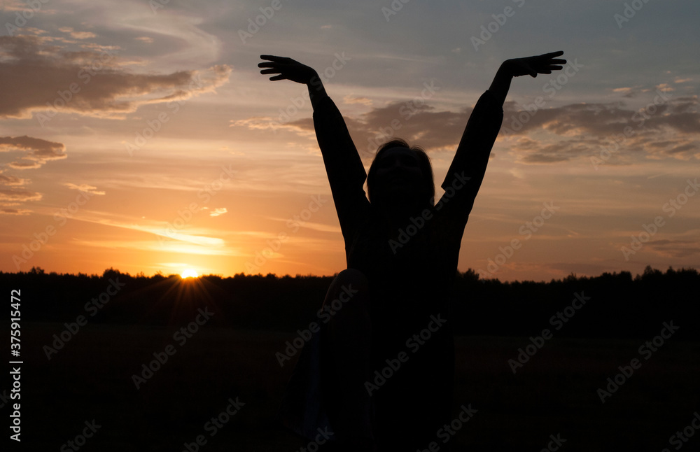 Fototapeta premium Silhouette of a girl. Sunrise