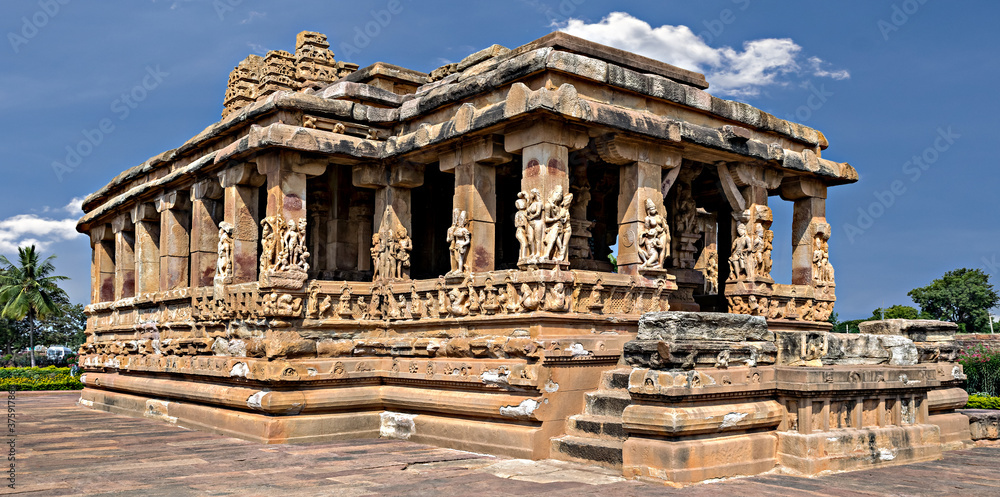 Entrance of Durga temple with blue sky and clouds, Aihole, Karnataka, India.