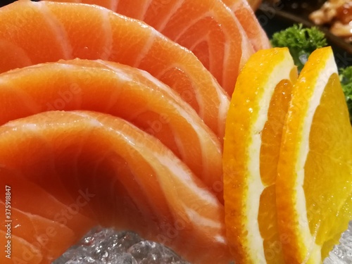 Orange salmon fillets, salmon slices. Salmon fillets served on ice. Japanese cuisine.