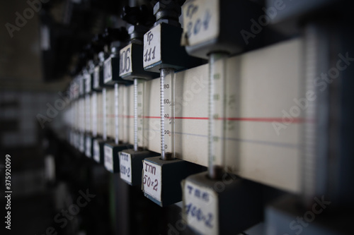 Obraz na płótnie Close-up of rotameters in a dark technical room