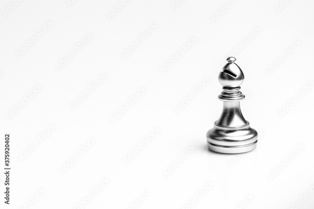 silver bishop chess standing alone on white background. - leadership concept. silver bishop chess standing alone on white background. - leadership concept.
