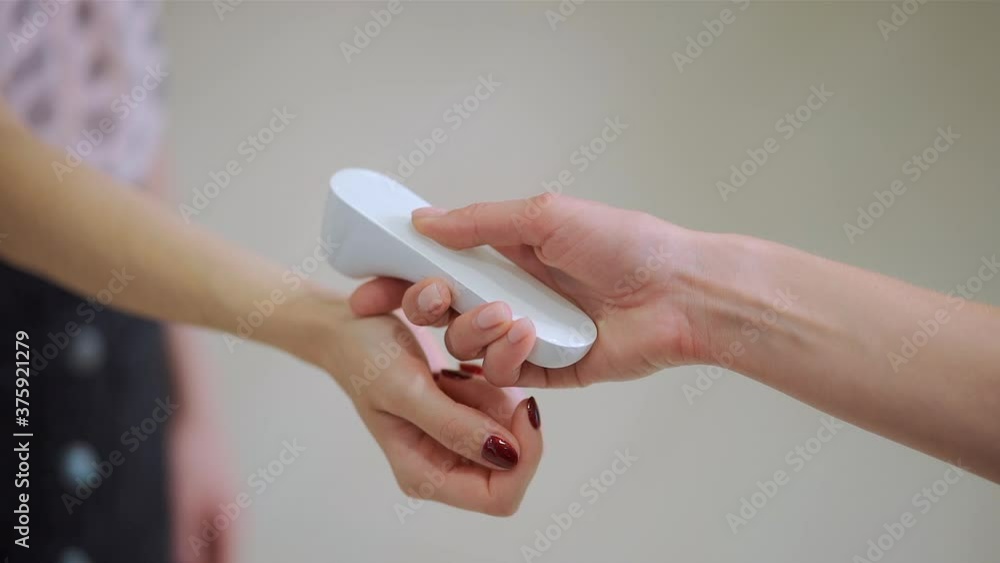 measuring temperature with infrared contactless thermometer at epidemic covid19 measuring temperature with infrared contactless thermometer at epidemic covid19