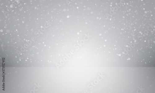 White sparkling particle on gray gradient background with spotlight lighting on center and floor for product display.