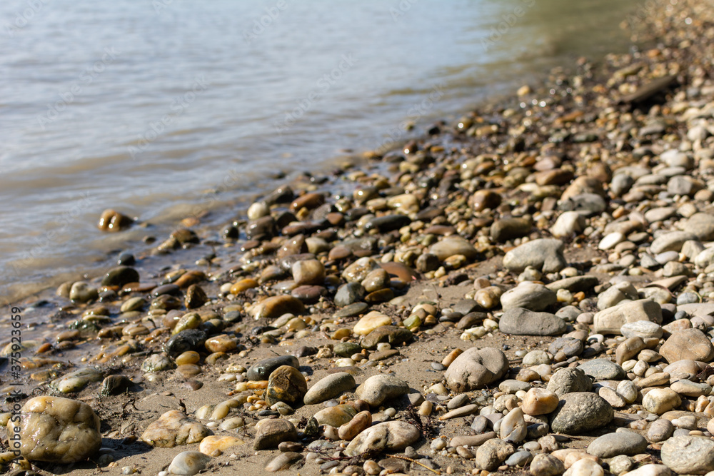 Pebble beach on the Danube River on a sunny summer day in Vienna, Austria Pebble beach on the Danube River on a sunny summer day in Vienna, Austria