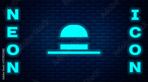 Glowing neon Elegant women hat icon isolated on brick wall background. Vector.