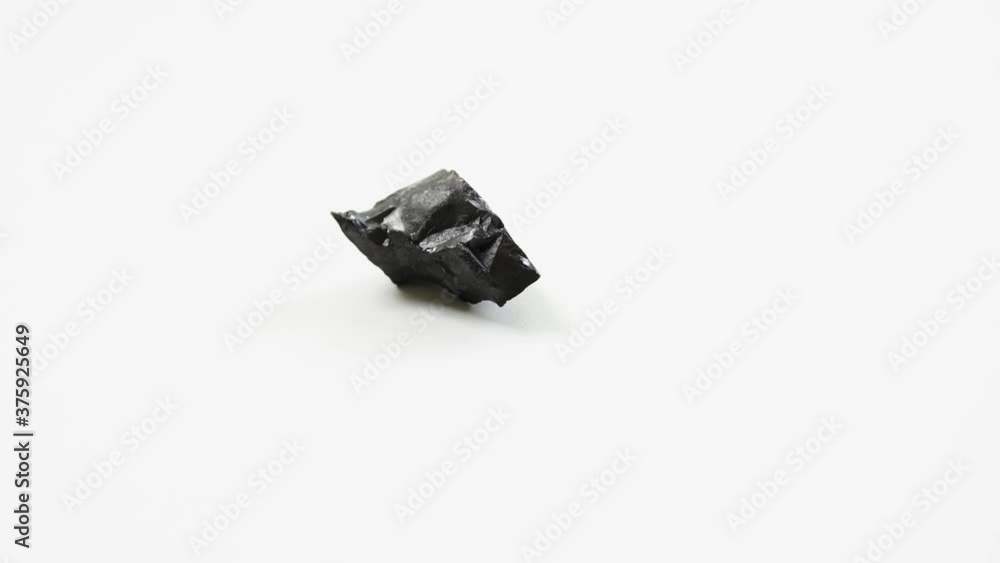 detail of anthracite coal over white background detail of anthracite coal over white background
