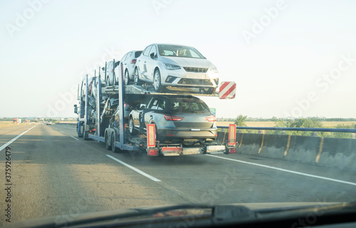 Car carrier trailer on divided highway road