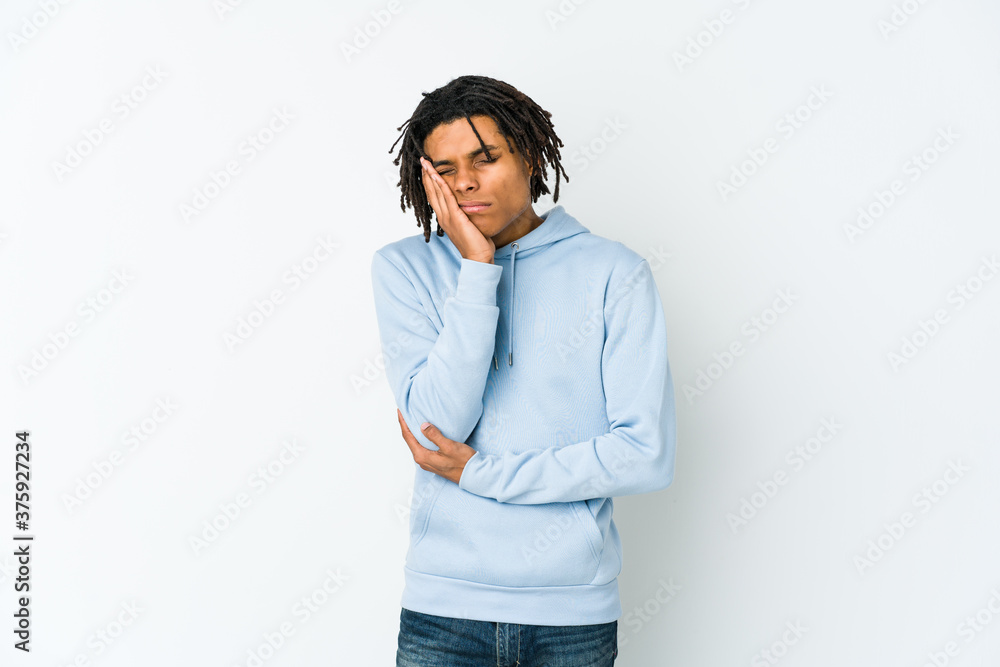 Young african american rasta man who is bored, fatigued and need a relax day. Young african american rasta man who is bored, fatigued and need a relax day.