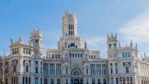 Exterior facade of the post office building in Plaza Cibeles in Madrid Spain on sunny day with a blue sky