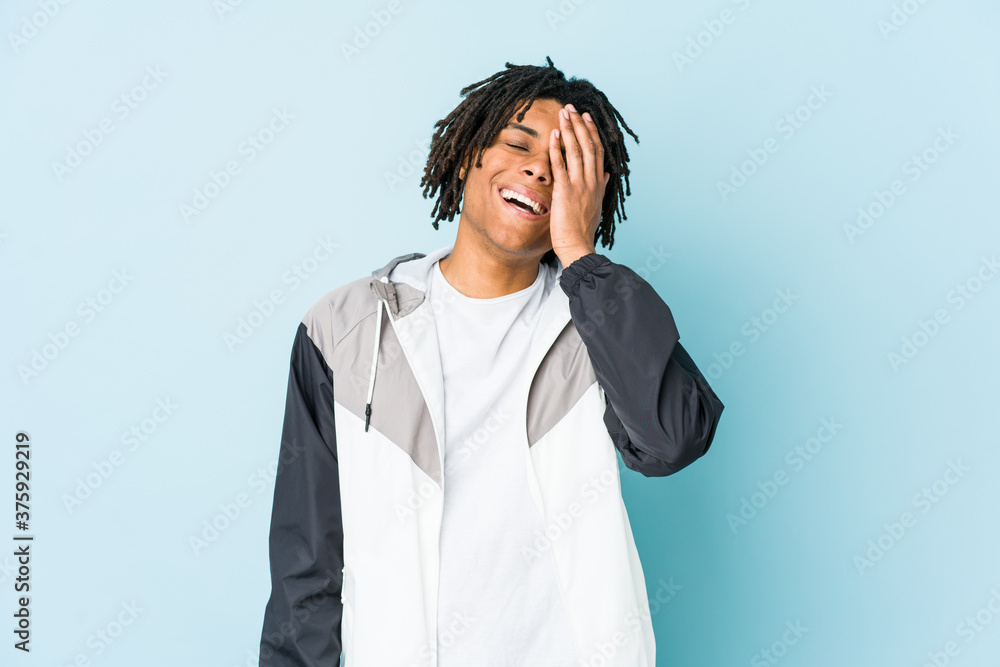 Young african american sport man laughing happy, carefree, natural emotion. Young african american sport man laughing happy, carefree, natural emotion.