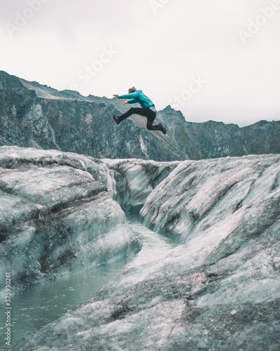 Εκτύπωση καμβά Jumping over a glacier crevasse
