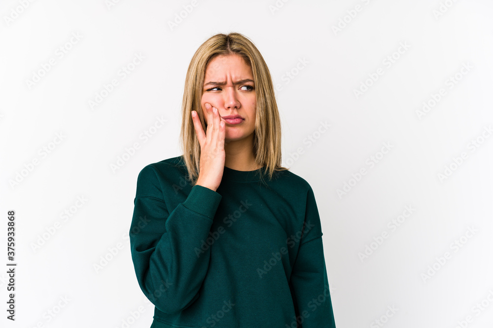 Young blonde caucasian woman isolated having a strong teeth pain, molar ache. Young blonde caucasian woman isolated having a strong teeth pain, molar ache.