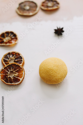 Natural handmade soap with dried slices of oranges on a white background. Concept of Spa, body and skin care. 
