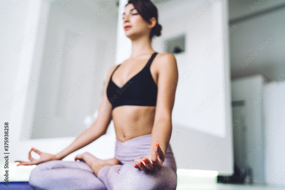 Young eyes closed woman in lotus pose Young eyes closed woman in lotus pose