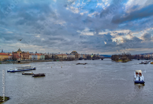 Beautiful view of the Vltava river in Prague, Czech Republic at dusk. 
