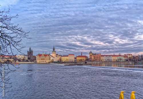 Beautiful view of the Vltava river in Prague, Czech Republic at dusk. 
