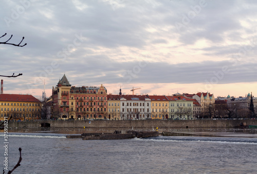 Beautiful view of the Vltava river in Prague, Czech Republic at dusk. 
