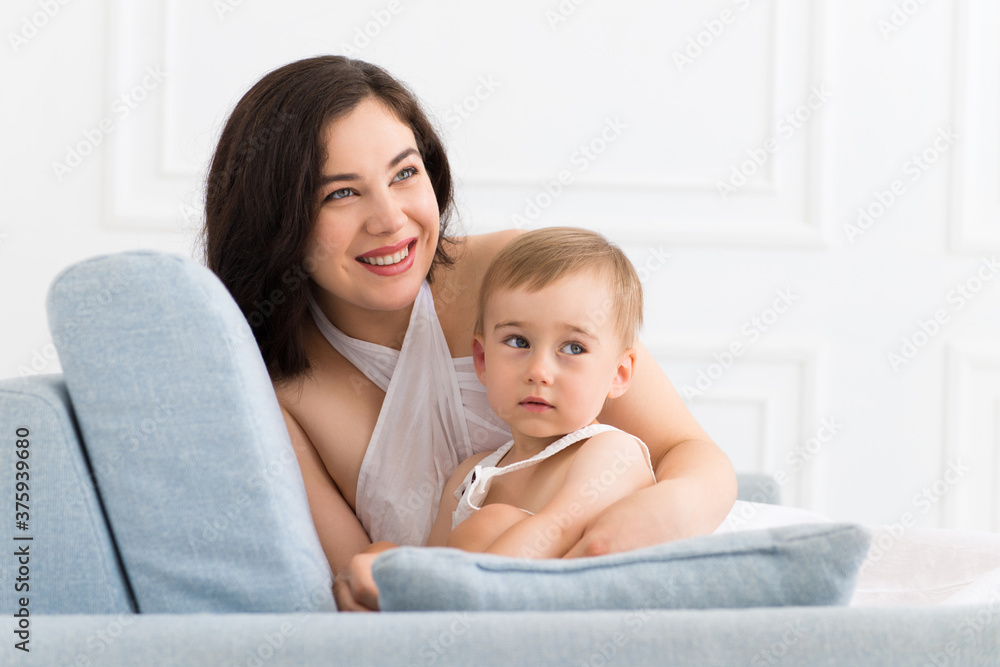 happy family in living room - woman and baby boy communicating happy family in living room - woman and baby boy communicating