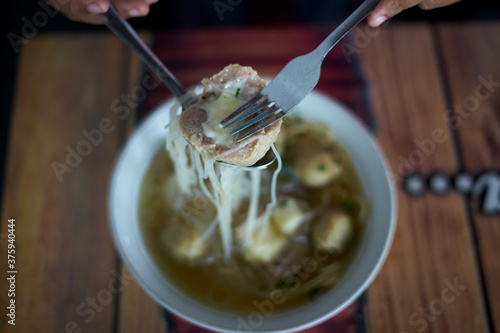 Meatballs with Noodle Soup on table at street food market