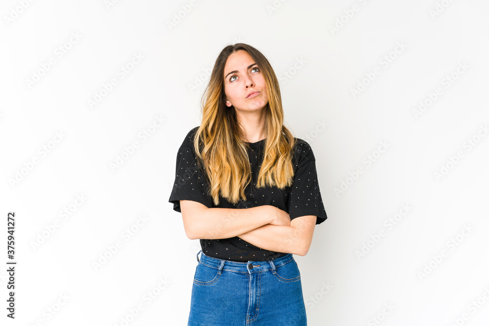 Young caucasian woman isolated on white background tired of a repetitive task. Young caucasian woman isolated on white background tired of a repetitive task.