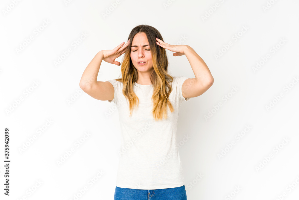 Young caucasian woman isolated on white background touching temples and having headache. Young caucasian woman isolated on white background touching temples and having headache.