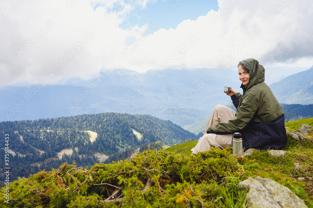 Young woman hiker stand in beautiful mountains on hiking trip. Active tourist resting outdoors in nature. Backpacker camping outside recreation active Young woman hiker stand in beautiful mountains on hiking trip. Active tourist resting outdoors in nature. Backpacker camping outside recreation active
