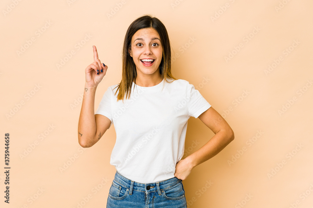 Young woman isolated on beige background having an idea, inspiration concept. Young woman isolated on beige background having an idea, inspiration concept.