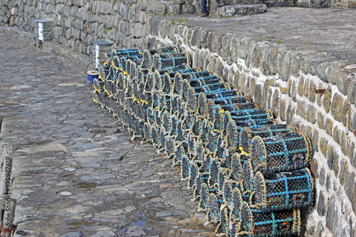 Fototapeta Naklejka Na Ścianę i Meble -  Crab pots at Clovelly harbour , Devon	