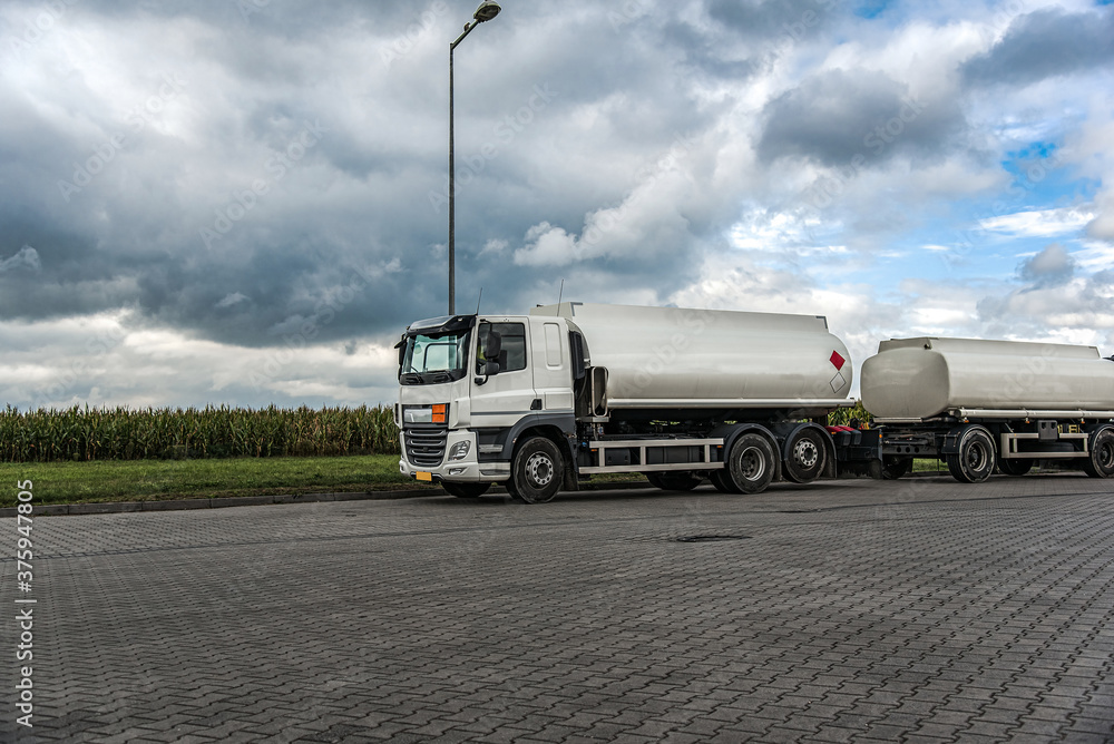 fuel truck at gas station, delivery of dangerous goods