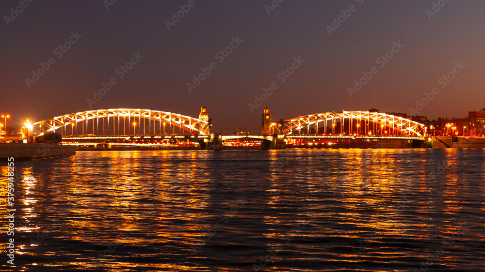 Naklejka premium Bridge of Peter Great in Saint-Petersburg, Russia. Night view.