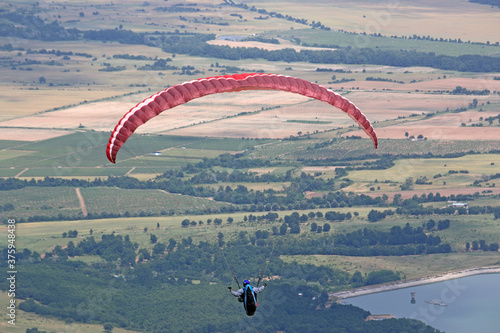 Paraglider flying from Dobrostan in Bulgaria	 photo