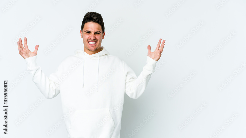 Young caucasian man isolated on white background screaming with rage. Young caucasian man isolated on white background screaming with rage.