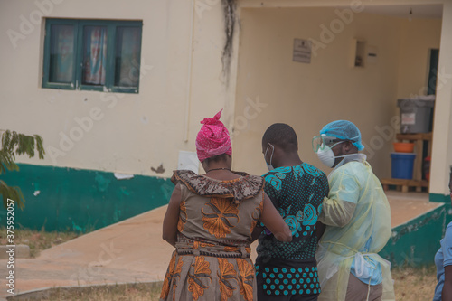 Covid-19 positive patient, taken to covid hospital isolation by medical staff and care taker (family member)