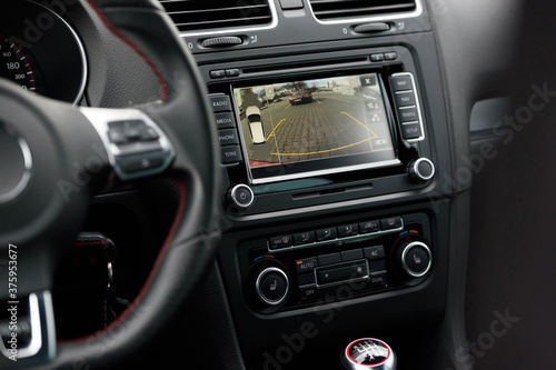 Interior of premium sport car. Work of front side, side, and rear view camera in 360 degrees system. Help assist options inside car. © Андрей Жерновой