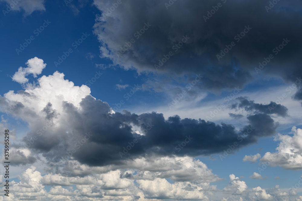 Fototapeta premium Sky panorama with gray dark thunderclouds before rain or storm. 