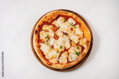 Italian pizza on a white background. Top view.
