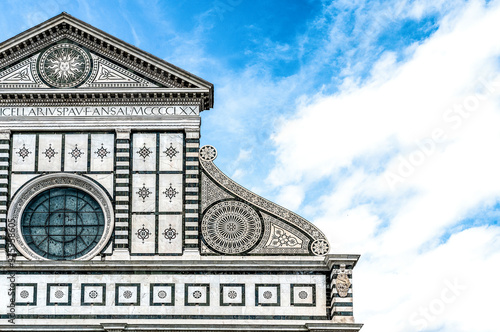 Close-up of the façade of the Basilica of Santa Maria Novella in Florence, Italy, with its white marble facade in Renaissance style. photo