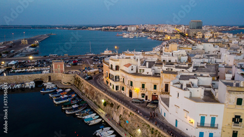 Aerial view of Gallipoli on the Salento peninsula in the south of Italy  Apulia  - City built on a narrow peninsula in the Ionian Sea at sunset