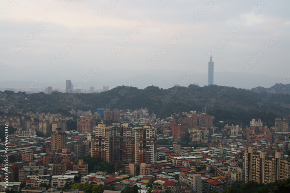Fototapeta premium Cloudy view of the JeiMi cityscape from Xianjiyan