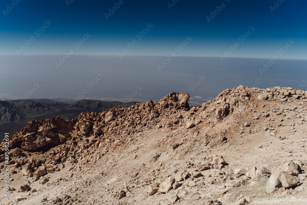 Teide National Park. Beautiful view of volcano. Desert area of a volcanic crater with rocks and mountains. Mount in Tenerife. Canary Islands